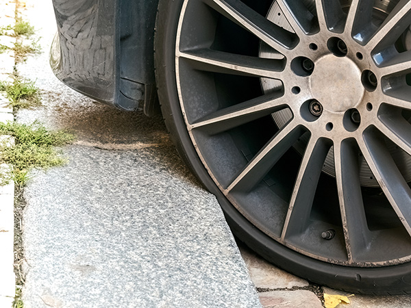 Can Hitting a Curb Cause Serious Tire Damage? | Neighborhood Tire Pros